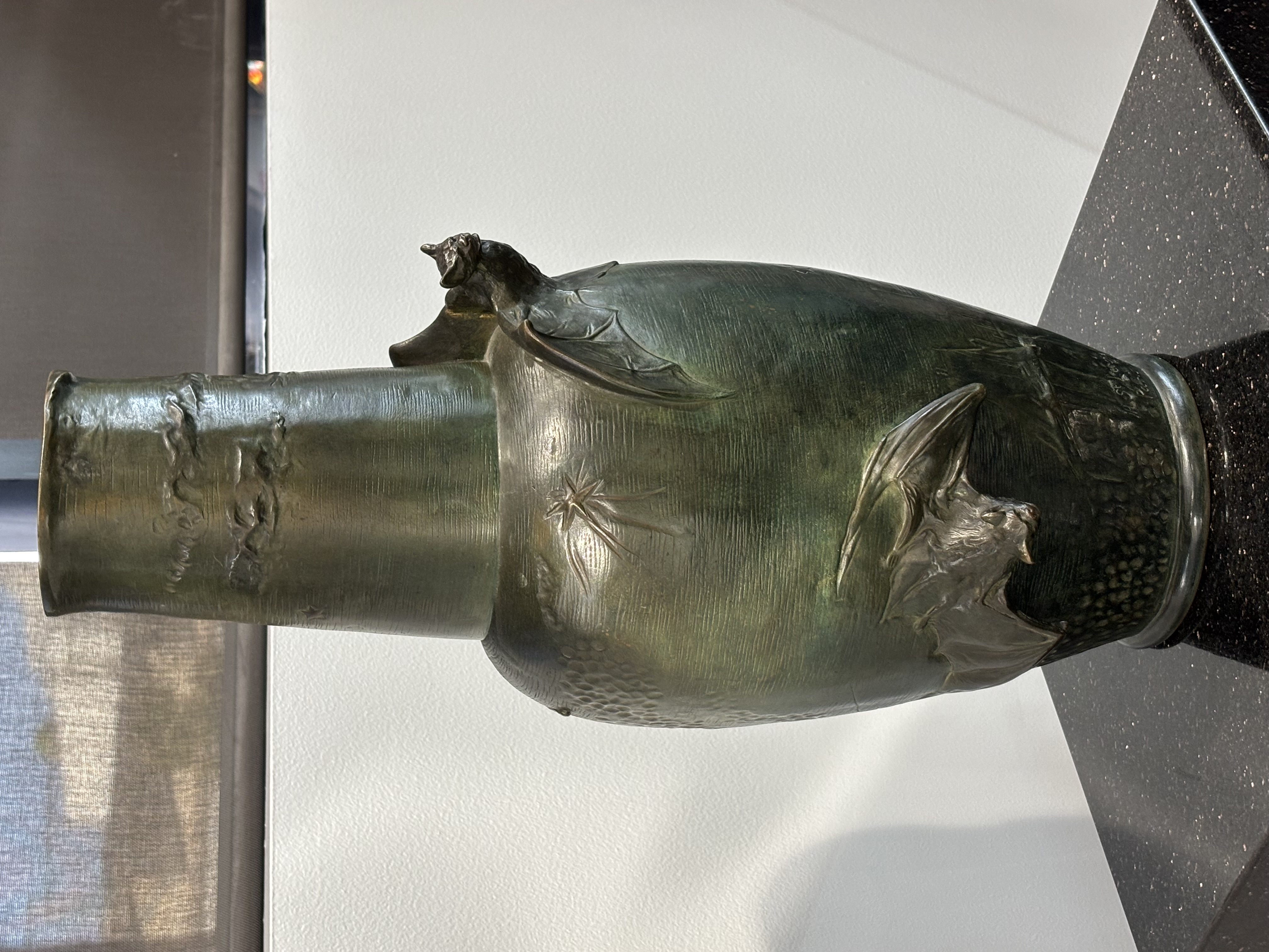 Vase Decorated With Bats in Flight Among Evening Clouds